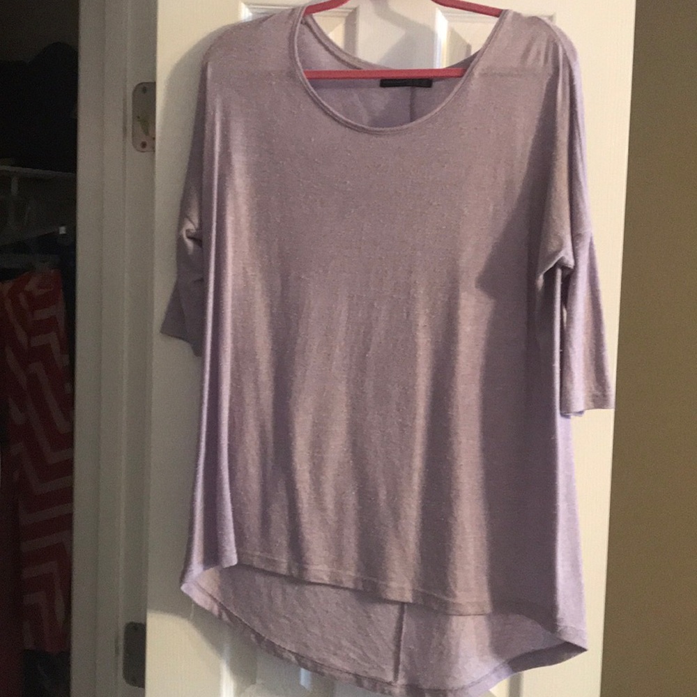 Light purple shirt.